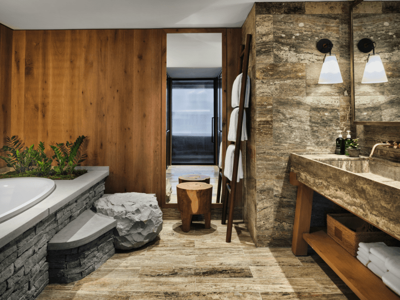 Porcelain tile bathroom with grey brick bathtub