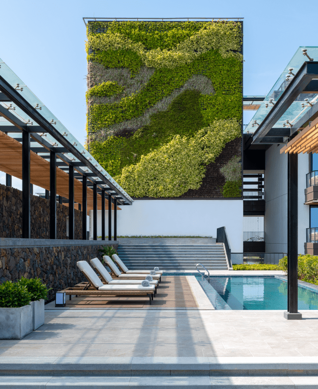 An eco-friendly green wall provides a refreshing backdrop to the Sky Villa pool area